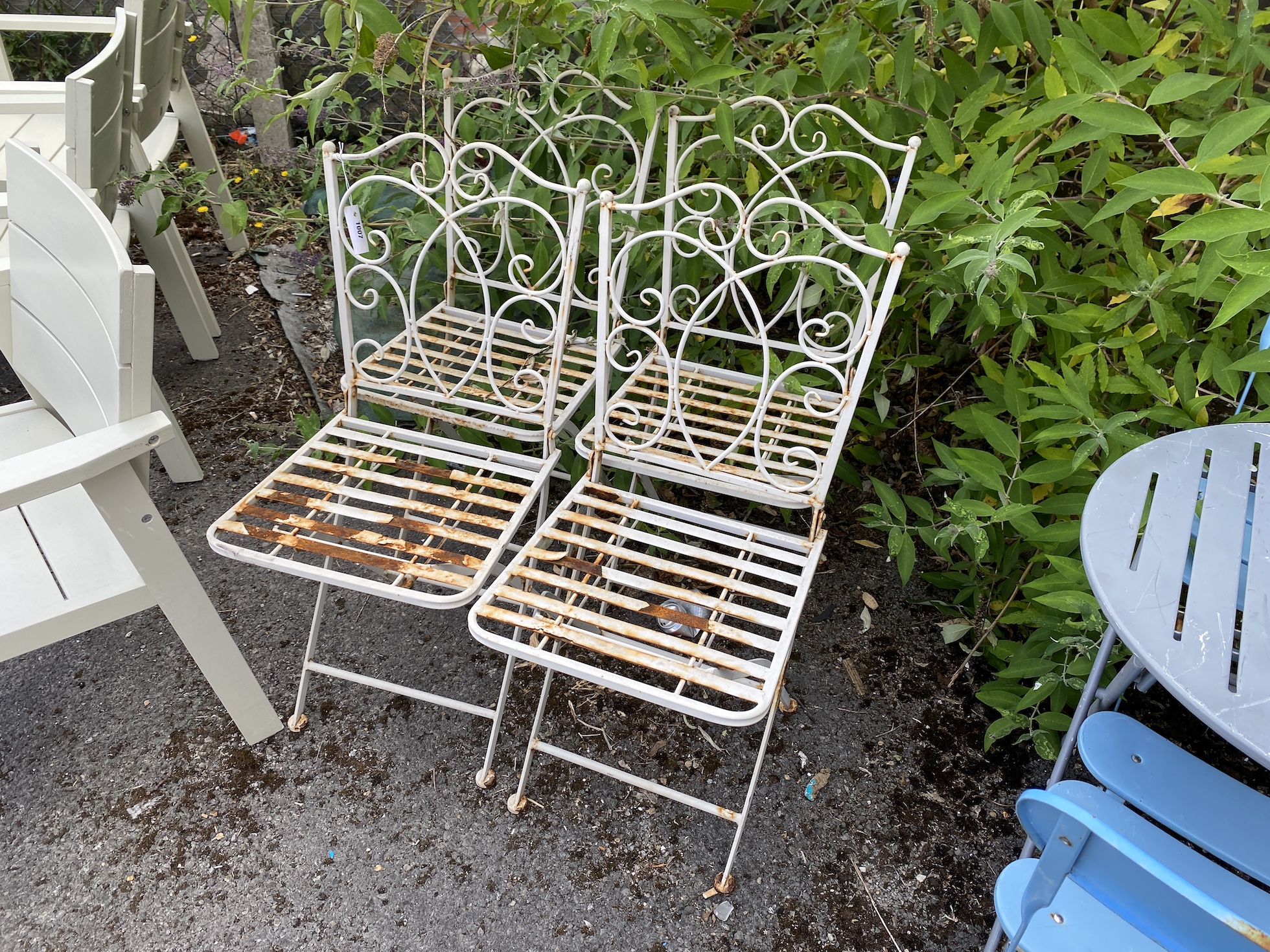 Four painted metal folding garden chairs